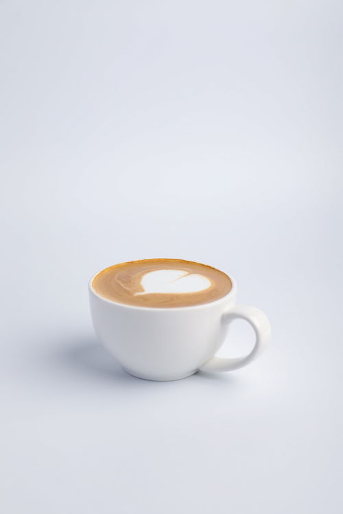 奶泡咖啡拉花咖啡咖啡店饮品摄影图 摄影素材
